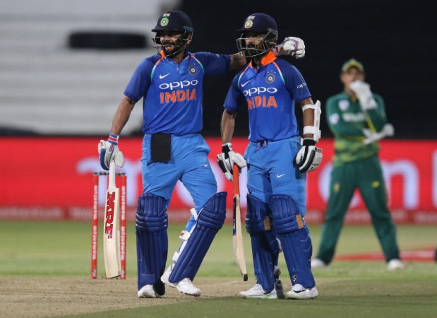 Virat Kohli (L) and Ajinkya Rahane celebrate the 100 partnership during the first One Day International (ODI) cricket match between South Africa and India at Kingsmead Cricket Ground on February 1, 2018 in Durban. Virat Kohli and Ajinkya Rahane