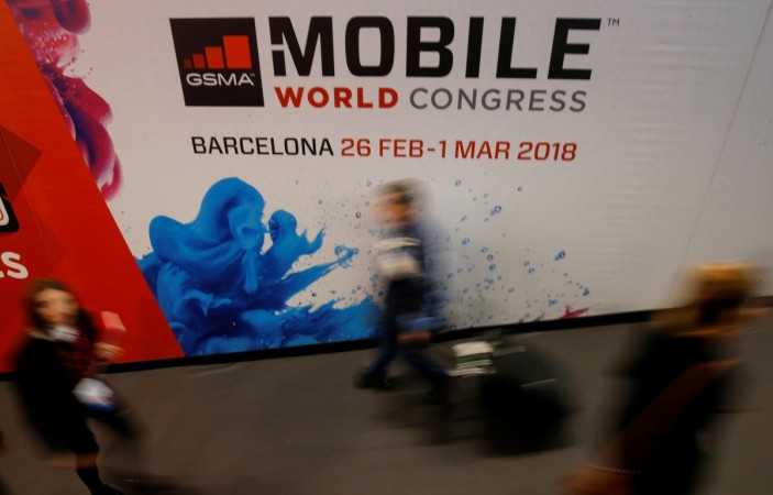 People walk past a hall at the Mobile World Congress in Barcelona, Spain February 26, 2017. People walk past a hall at the Mobile World Congress in Barcelona, Spain