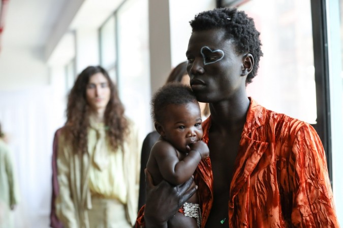 Model George Okeny walks the runway at the Collina Strada AW18 Collection with his son Zola during New York Fashion Week on February 8, 2018 in New York City. Models walk the runway at the Collina Strada AW18 Collection during New York Fashion Week on February 8, 2018 in New York City.