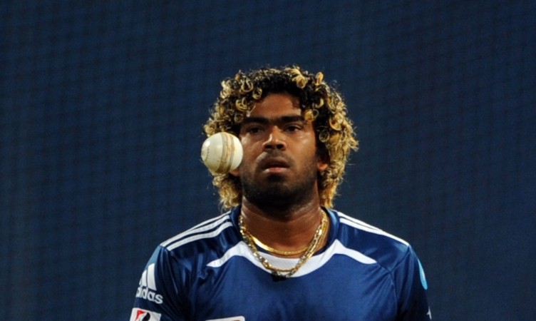 File photo: Sri Lankan fast bowler and Mumbai Indians player Lasith Malinga tosses a ball during a warm-up session ahead of the IPL match in 2011. Lasith Malinga