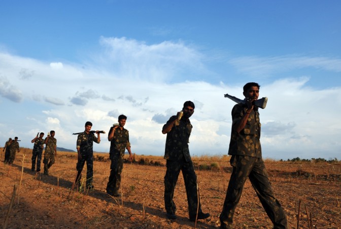 Indian Special Security Force personnel deployed for anti-Naxal operations perform a security sweep Naxal