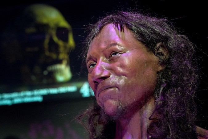 A full face reconstruction model made from the skull of a 10,000-year-old man, known as 'Cheddar Man', Britain's oldest complete skeleton is pictured during a press preview at the National History Museum in London on February 6, 2018. Cheddar Man