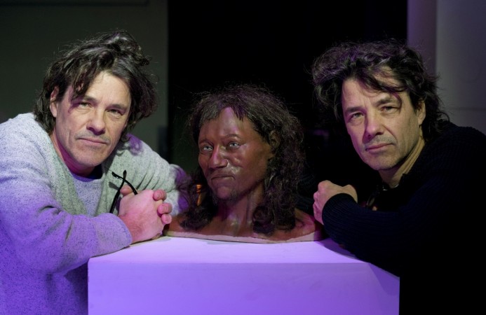 Model makers Adrie (L) and Alfons Kennis pose with their full face reconstruction model, made from the skull of a 10,000-year-old man, known as 'Cheddar Man', Britain's oldest complete skeleton, during a press preview at the National History Museum in London on February 6, 2018. Cheddar Man