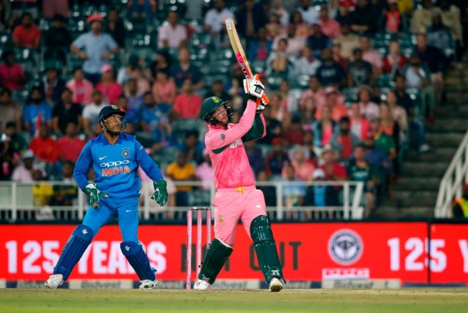 South African batsman Heinrich Klaasen (R) hits a six during the fourth ODI between South Africa and India at Wanderers cricket ground on February 10, 2018 in Johannesburg. Heinrich Klaasen