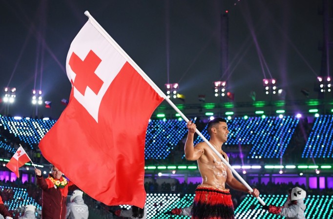 Flag bearer Pita Taufatofua of Tonga and teammates enter the stadium during the Opening Ceremony of the PyeongChang 2018 Winter Olympic Games at PyeongChang Olympic Stadium on February 9, 2018 in Pyeongchang-gun, South Korea. Winter Olympics