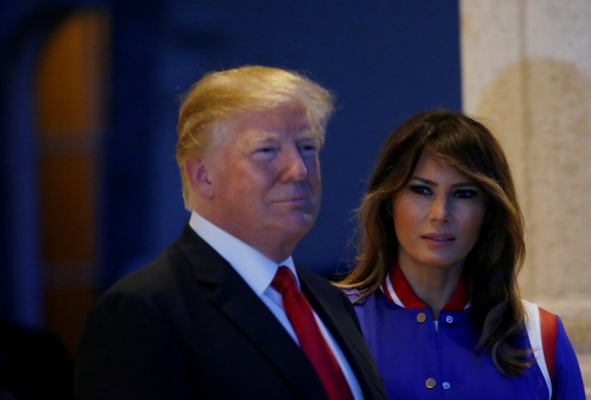 U.S. President Donald Trump and first lady Melania Trump watch the Florida Atlantic University Marching Band before hosting a Super Bowl LII watch party at Trump International Golf Club in Palm Beach, Florida U.S., February 4, 2018 trump