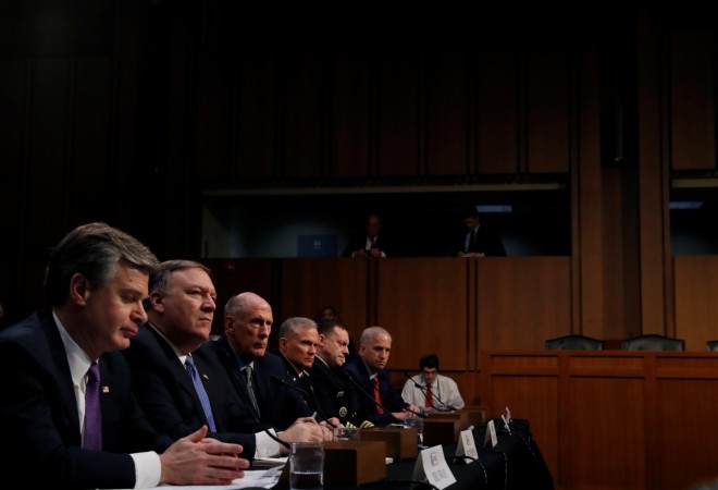 Federal Bureau of Investigation (FBI) Director Christopher Wray, Central Intelligence Agency (CIA) Director Mike Pompeo, Director of National Intelligence (DNI) Dan Coats, Defense Intelligence Agency Director Robert Ashley, National Security Agency (NSA) Director Michael Rogers, and National Geospatial Intelligence Agency Director Robert Cardillo testify during a Senate Intelligence Committee hearing on Huawei's troubles with US lawmakers see no end