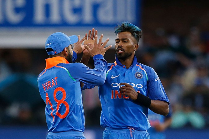 Virat Kohli (L) celebrates with Hardik Pandya (R) after the dismissal of JP Duminy (unseen) during the fifth ODI on February 13, 2018. Hardik Pandya and Virat Kohli