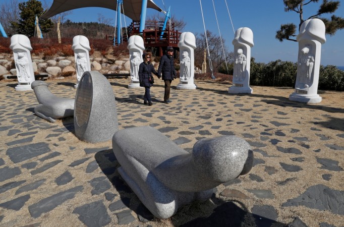 Tourists look at statues in South Korea's Haeshindang Park, also know as Tourists look at statues in South Korea's Haeshindang Park, also know as