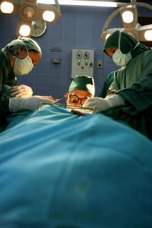 Doctors conduct a vagina surgery on a patient at a private clinic in Jakarta. Vaginal surgery