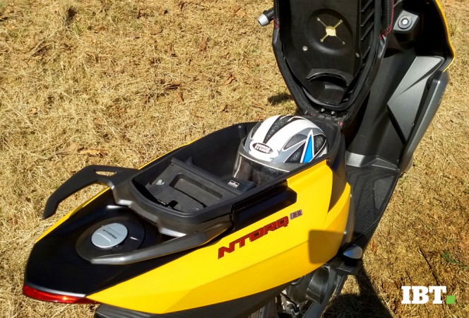 TVS Ntorq 125 comes with a decent under the seat storage but not good enough to accommodate a full face helmet. TVS Ntorq 125