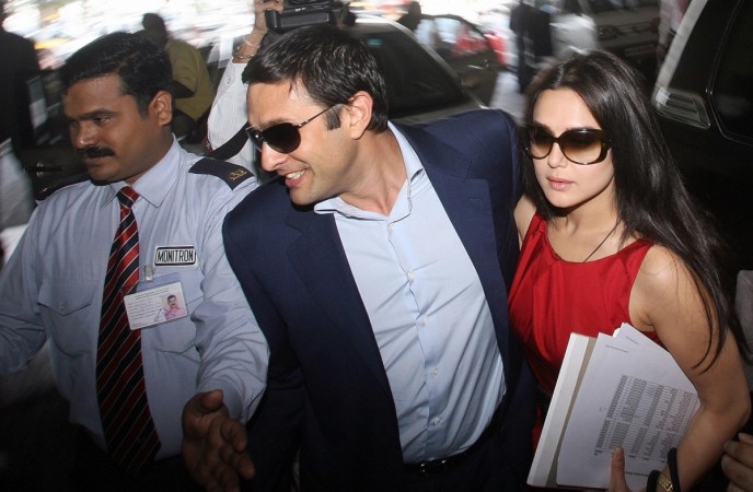 Ness Wadia (centre) and Bollywood actress Preity Zinta, co-owners of Indian Premier League (IPL) team Kings XI Punjab, arrive at players' auction in Mumbai on February 20, 2008. Board of Control for Cricket in India (BCCI) has sought an explanation from Kings XI Punjab on Wadi's conviction and sentencing in Japan in a drug case. Preity Zinta and Ness Wadia