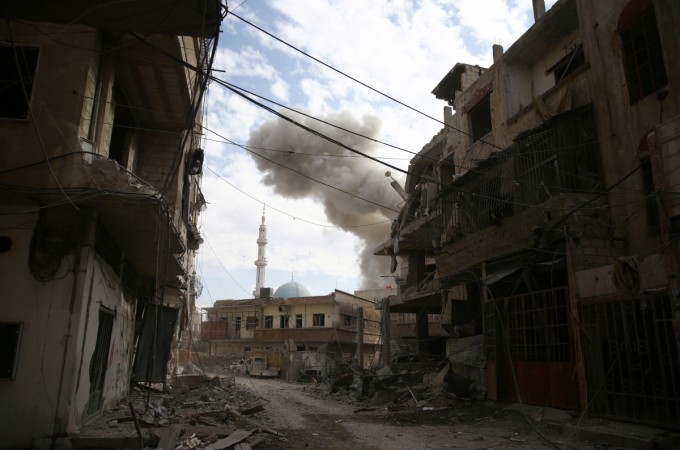 A general view of damaged houses after an air raid in the besieged town of Ghouta. syria