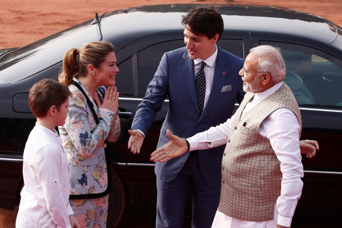Narendra Modi extends his hand for a handshake with his Canadian counterpart Justin Trudeau's wife Sophie Gregoire during Trudeau's ceremonial reception Justin Trudeau and wife Sophie