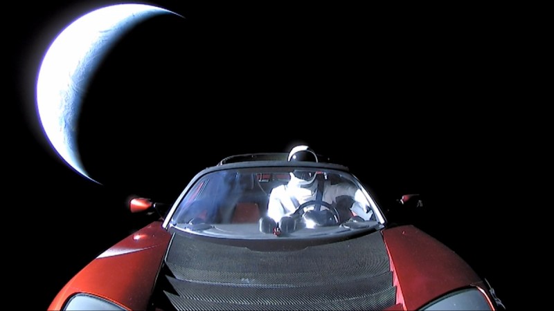 A cherry red Tesla Roadster automobile floats through space after it was carried there by SpaceX's Falcon Heavy in this image obtained by Reuters on February 9, 2018.