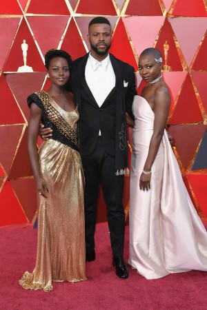 (L-R) Lupita Nyong'o, Winston Duke, and Danai Gurira attend the 90th Annual Academy Awards at Hollywood & Highland Center on March 4, 2018 in Hollywood, California. (L-R) Lupita Nyong'o, Winston Duke, and Danai Gurira attend the 90th Annual Academy Awards at Hollywood & Highland Center on March 4, 2018 in Hollywood, California.