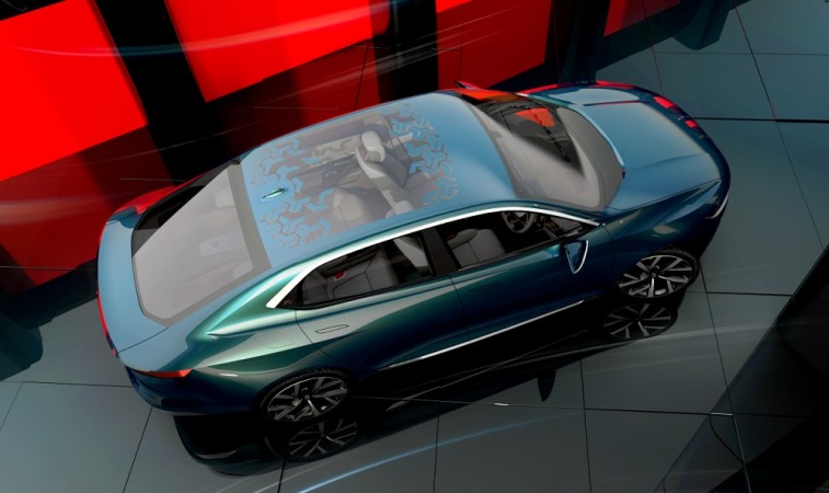 Tata E-Vision electric sedan concept gets a flamboyant design that reminds us Aston Martin Lagonda. Tata E-Vision electric sedan concept