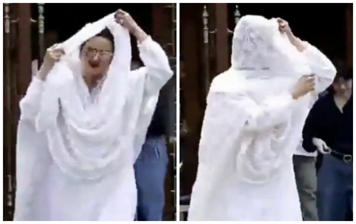 Rekha desperately hides face from camera Rekha desperately hides face from camera