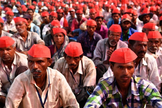 Farmers listen to speakers at the site of a protest rally in Mumbai on March 12, 2018. Maharashtra farmer protests