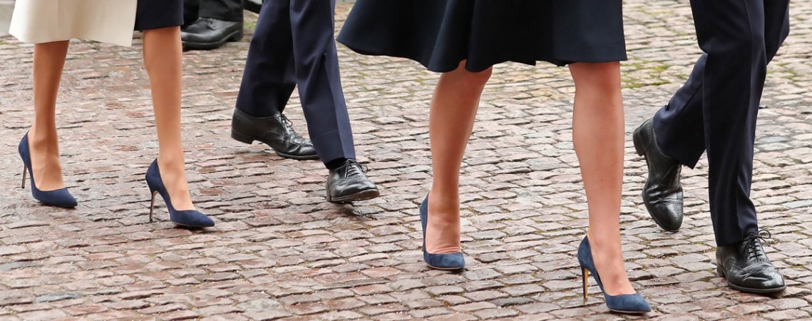The footwear worn by Britain's Catherine, Duchess of Cambridge, (2R) and her husband Britain's Prince William, Duke of Cambridge (R), Britain's Prince Harry (2L) and his fiancée US actress Meghan Markle (L) is pictured as they attend a Commonwealth Day Service at Westminster Abbey Kate Middleton Meghan Markle shoes