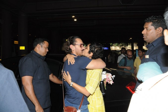 Aamir Khan kisses wife Kiran Rao at airport Aamir Khan kisses wife Kiran Rao at airport