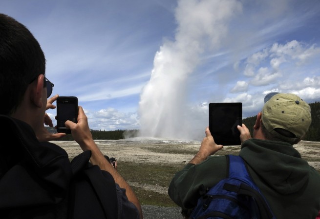 Old Faithful geyser erupting in Yellowstone National Park in Wyoming, May 16, 2014. Old Faithful geyser erupting in Yellowstone National Park in Wyoming, May 16, 2014.