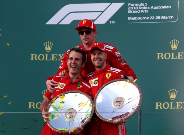 Sebastian Vettel celebrates his win on the podium with Ferrari's Kimi Raikkonen and Ferrari Race Strategist Inaki Rueda. Formula One F1 - Australian Grand Prix