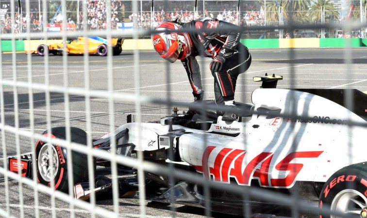 Haas F1's Danish driver Kevin Magnussen climbs out of his car after his car failed during the Formula One Australian Grand Prix in Melbourne on March 25, 2018. Haas F1 Team