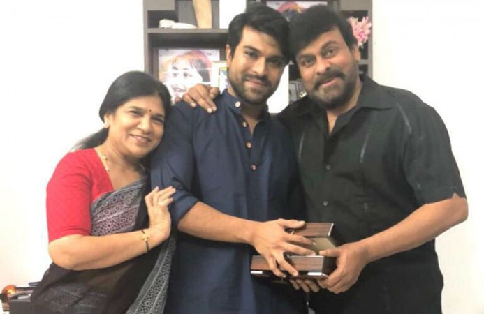 Chiranjeevi and his wife Sureka presenting special gift to son Ram Charan Chiranjeevi and his wife Sureka presenting special gift to son Ram Charan
