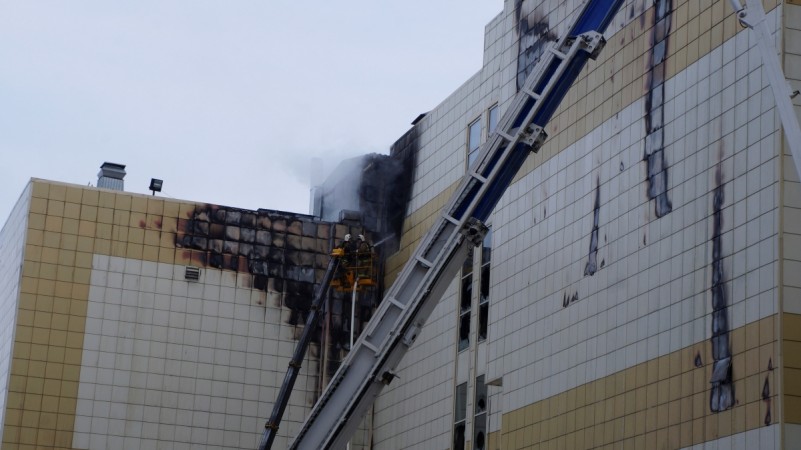 Members of the Emergency Situations Ministry work to extinguish a fire in a shopping mall in the Siberian city of Kemerovo, Russia March 26, 2018 Russia shopping mall fire