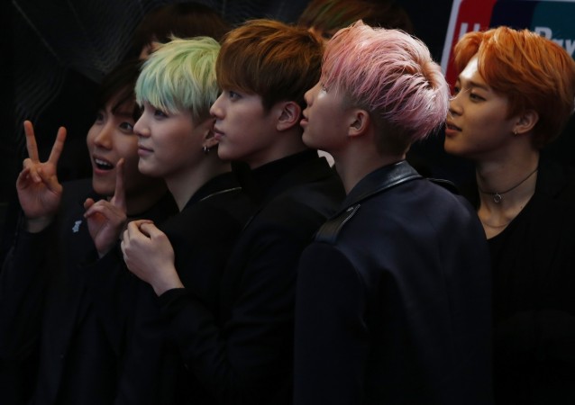 Members of South Korean K-Pop band BTS react on the red carpet during 2015 Mnet Asian Music Awards (MAMA) in Hong Kong, China, December 2, 2015. Members of South Korean K-Pop band BTS react on the red carpet during 2015 Mnet Asian Music Awards (MAMA) in Hong Kong, China, December 2, 2015.