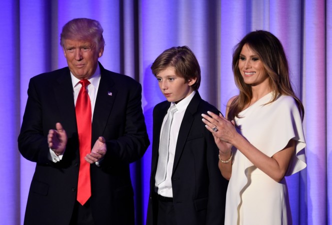US President-elect Donald Trump arrives with his son Baron and wife Melania at the New York Hilton Midtown in New York on November 8, 2016. Melania Trump son