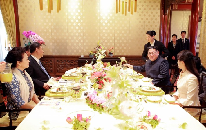 Xi Jinping his wife Peng Liyuan North Korean leader Kim Jong Un and his wife Ri Sol Ju during lunch in Beijing. Ri Sol-ju