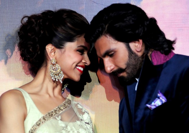 Indian Bollywood film actors Ranveer Singh (R) and Deepika Padukone attend their first look trailer launch of the upcoming romantic-drama Hindi film 'Ram Leela' directed and produced by Sanjay Leela Bhansali in Mumbai on September 16, 2013. Ranveer Singh and Deepika Padukone