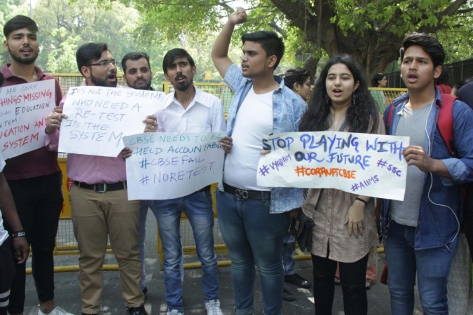 Students stage a demonstration against re-examination after the leak of CBSE Class X Maths and Class XII Economics papers, at Parliament Street CBSE paper leak