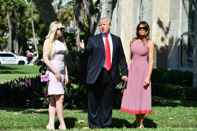 US President Donald Trump(C) with First Lady Melania Trump(R) and daughter Tiffany Trump (L) arrive for Easter service at the Church of Bethesda-by-the-Sea in Palm Beach, Florida, April 1, 2018. Melania Trump
