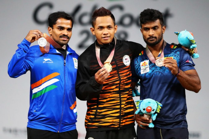 India's Gururaja (L) won a silver medal in the 56kg weighlifting event on Thursday, April 5. Gururaja Poojary