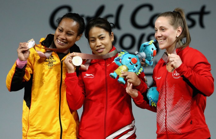 Sanjita Chanu outclassed veteran Dika Toua (L) of Papua New Guinea to win gold medal in the 53kg event. Sanjita Chanu