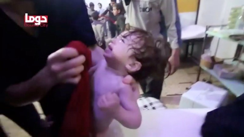 A child cries as they have their face wiped following alleged chemical weapons attack, in what is said to be Douma, Syria in this still image from video obtained by Reuters on April 8, 2018. Syria attack