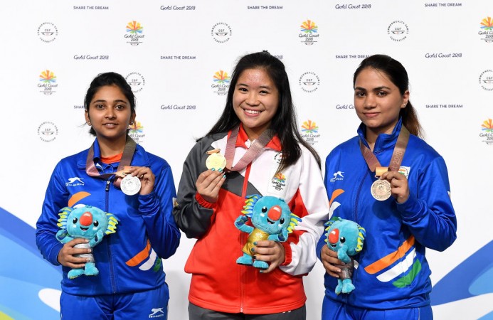 India's Mehuli Ghosh (L) and Apurvi Chandela (R) along with Singapore Martina Lindsay Veloso at the medal ceremony of 10m Air Rifle Final on Monday. Commonwealth Games 2018 10m Air Rifle