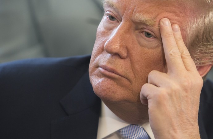 President Donald Trump listens to victims stories before signing H.R. 1865, the 'Allow States and Victims to Fight Online Sex Trafficking Act of 2017' at The White House in Washington, DC, April 11, 2018. donald trump