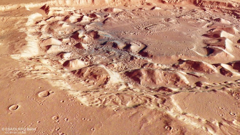 This image shows an oblique perspective view of Ismenia Patera, a crater located in the Arabia Terra region of Mars' surface Martian crater