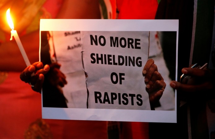 Participate in a candle light vigil as they protest against the rape of an eight-year-old girl in Kathua near Jammu protests against Kathua rape