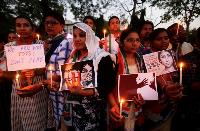 participate in a candle light vigil as they protest against the rape of an eight-year-old girl in Kathua near Jammu Kathua rape