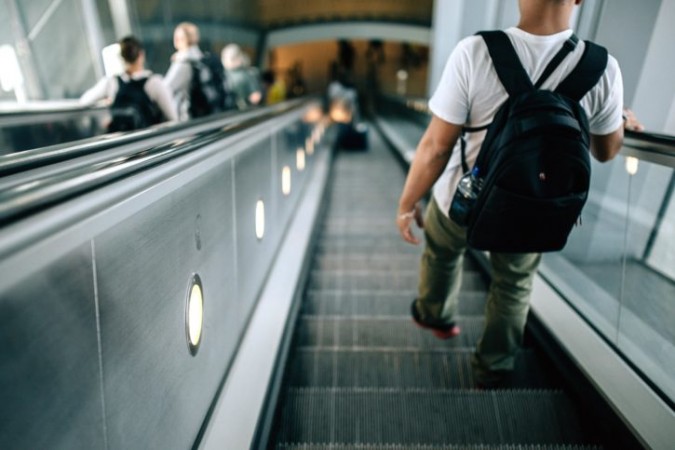 The strap of the boy's bag got stuck in the escalator. (Representational Image) escalator