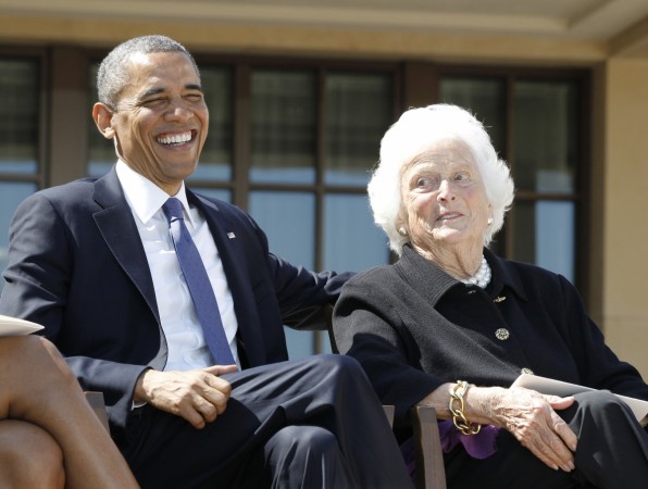 Former US president Barack Obama laughs alongside former first lady Barbara Bush during the dedication ceremony for the George W. Bush Presidential Center in Dallas, April 25, 2013. Barbara Bush