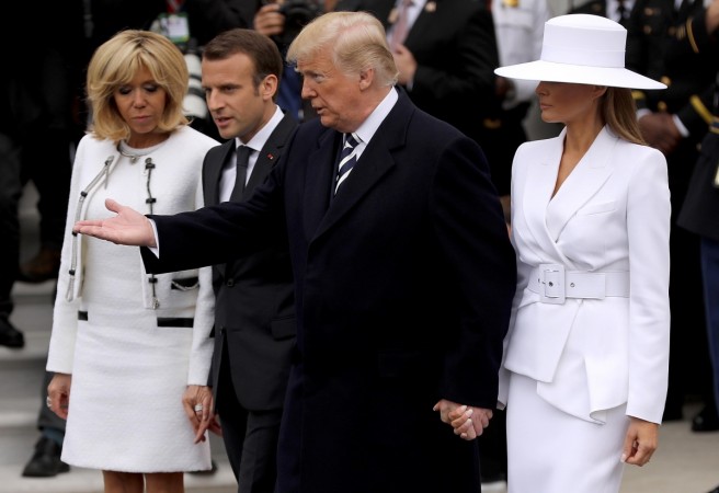 US President Donald Trump (2nd R) and US first lady Melania Trump (R) welcome French President Emmanuel Macron (2nd L) and his wife Brigitte to the White House during a state arrival ceremony April 24, 2018 in Washington, DC. Donald Trump