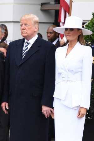 French President Emmanuel Macron (2nd L), US President Donald Trump (2nd R), First Lady Melania Trump (R) and Brigitte Macron participate in a state welcome at the White House in Washington, DC, on April 24, 2018. Donald Trump