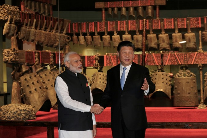 Indian prime minister Narendra Modi and Chinese president interact during the informal summit in Wuhan. xi jinping