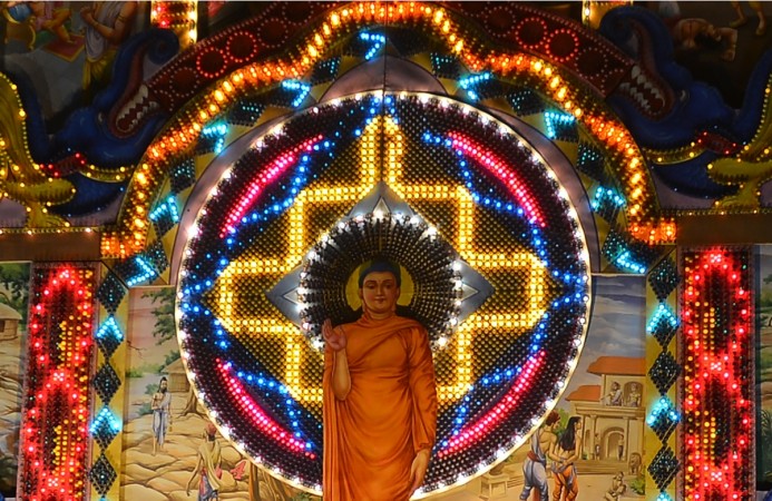 A view of a giant Vesak day display featuring a seated Buddha during the annual Buddhist festival of Vesak in Colombo on April 29, 2018 Buddha Purnima